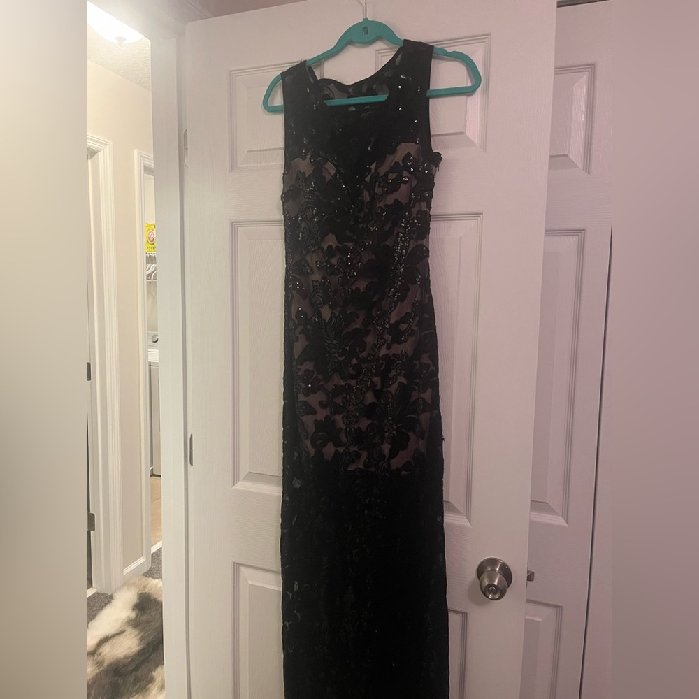 Beautiful sequence and lace black gown.